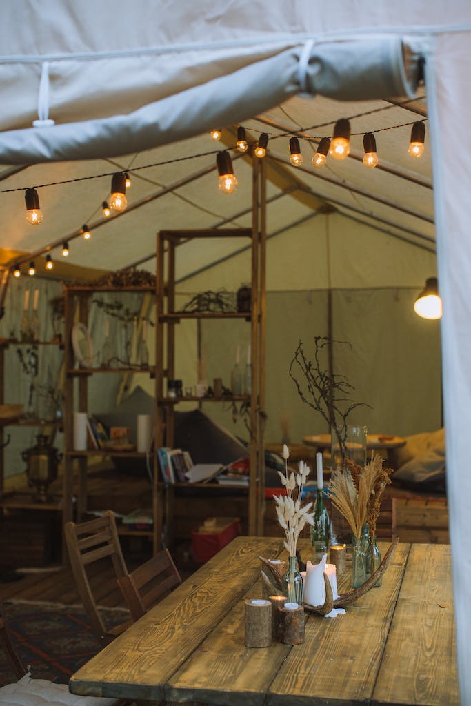 Tables and String Lights Inside a Tent